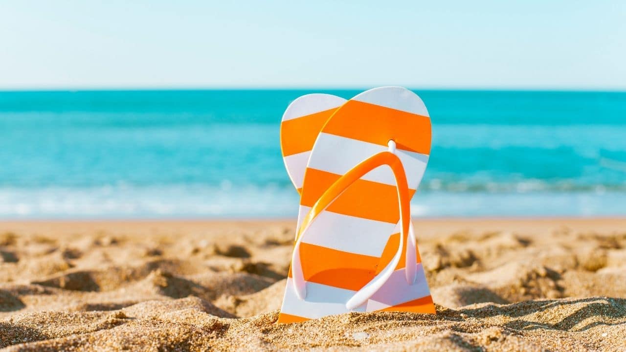 orange-stripe-slippers-sand-beach