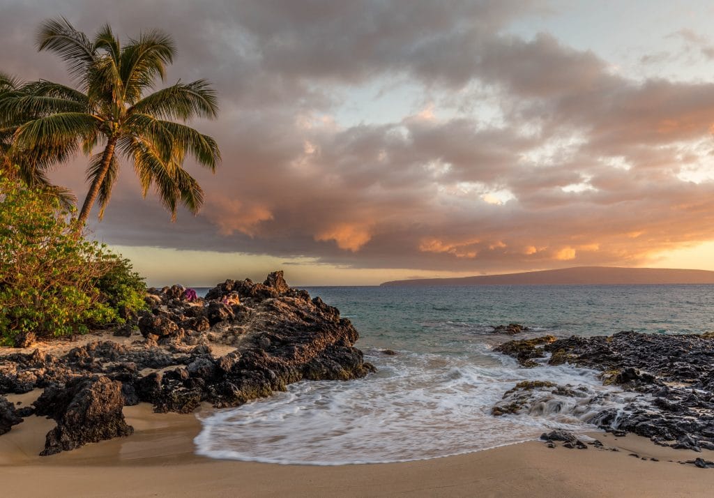 A sunset overlooking a Hawaii Beach - Best time to visit Hawaii