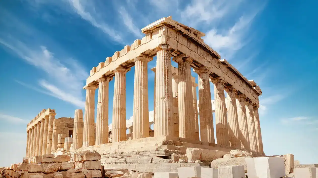 The Parthenon framed by a blue sky.