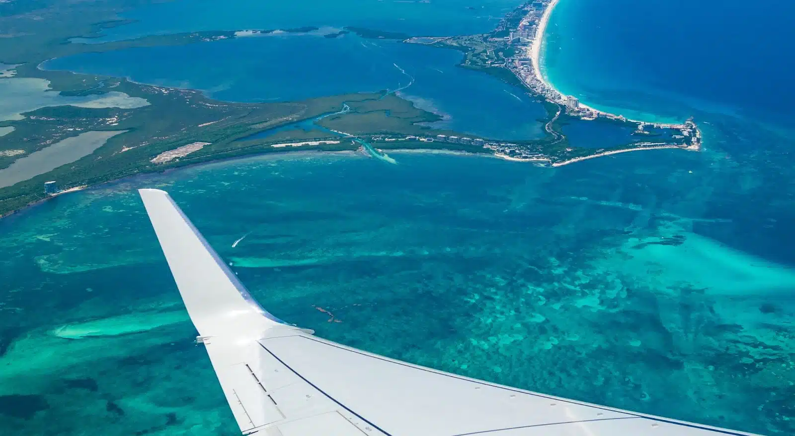 Plane wing over Cancun