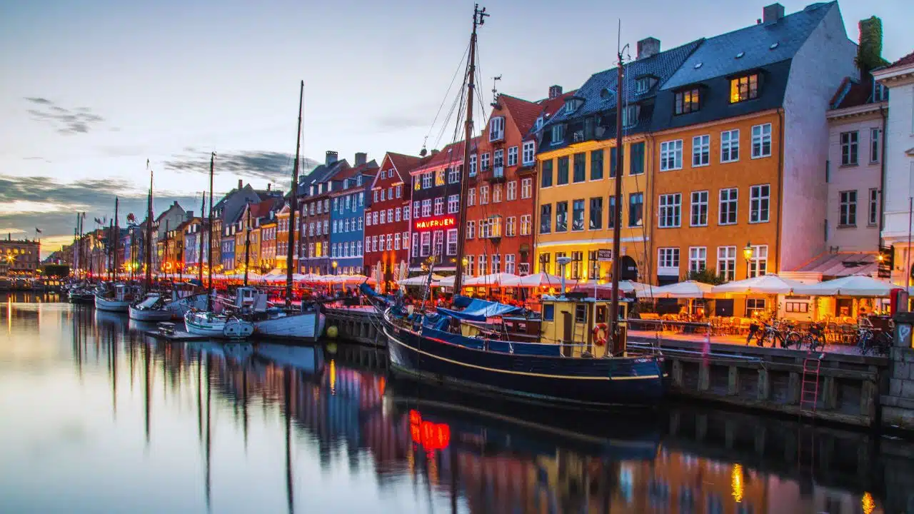 View of colorful buildings bordering canal in Copenhagen, Denmark