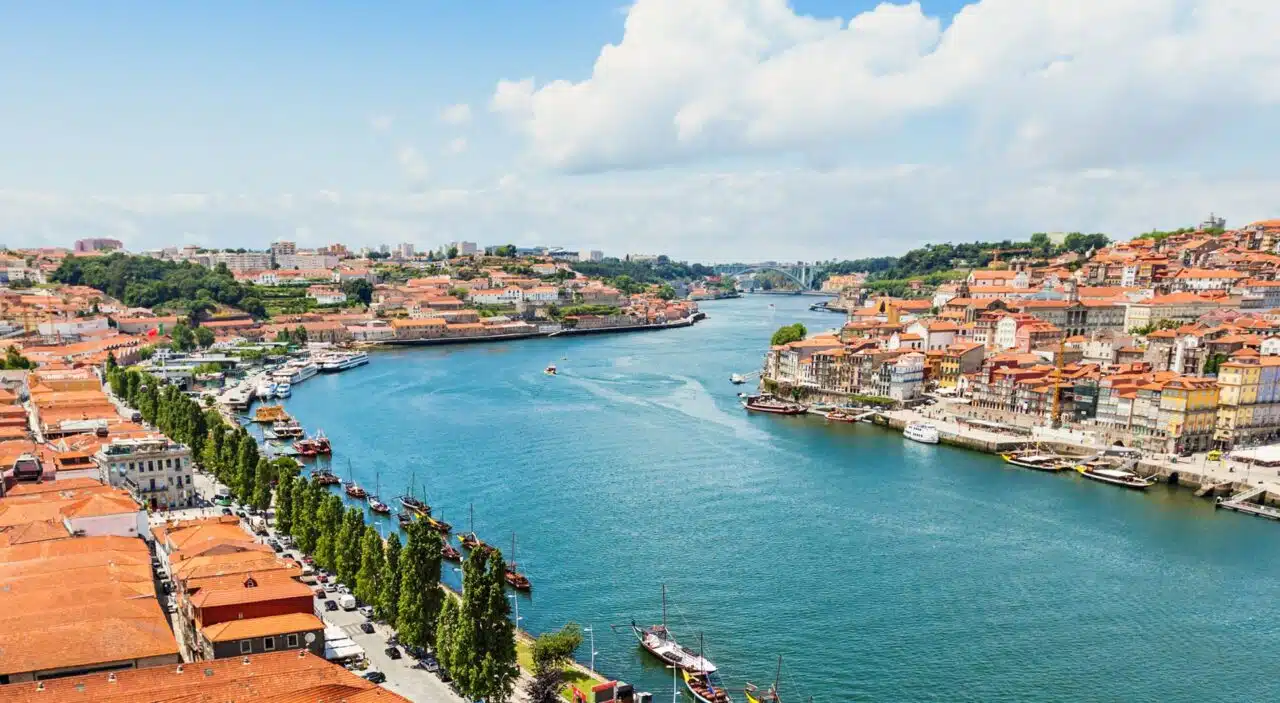 Douro River with view of traditional boats and Porto neighborhoods