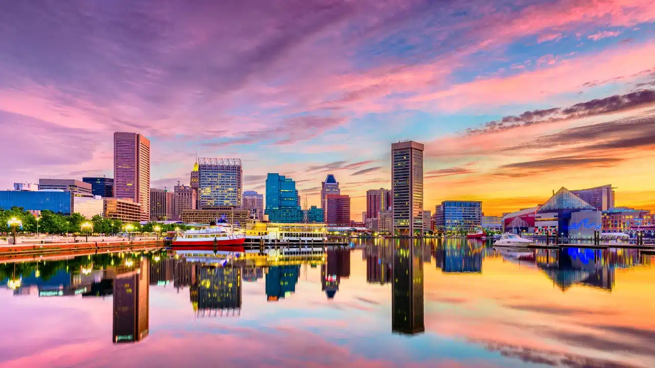 Scenic sunset over Baltimore Inner Harbor in Maryland, showcasing the city's waterfront skyline, marina, and iconic harbor views, one of Baltimore's top travel attractions.
