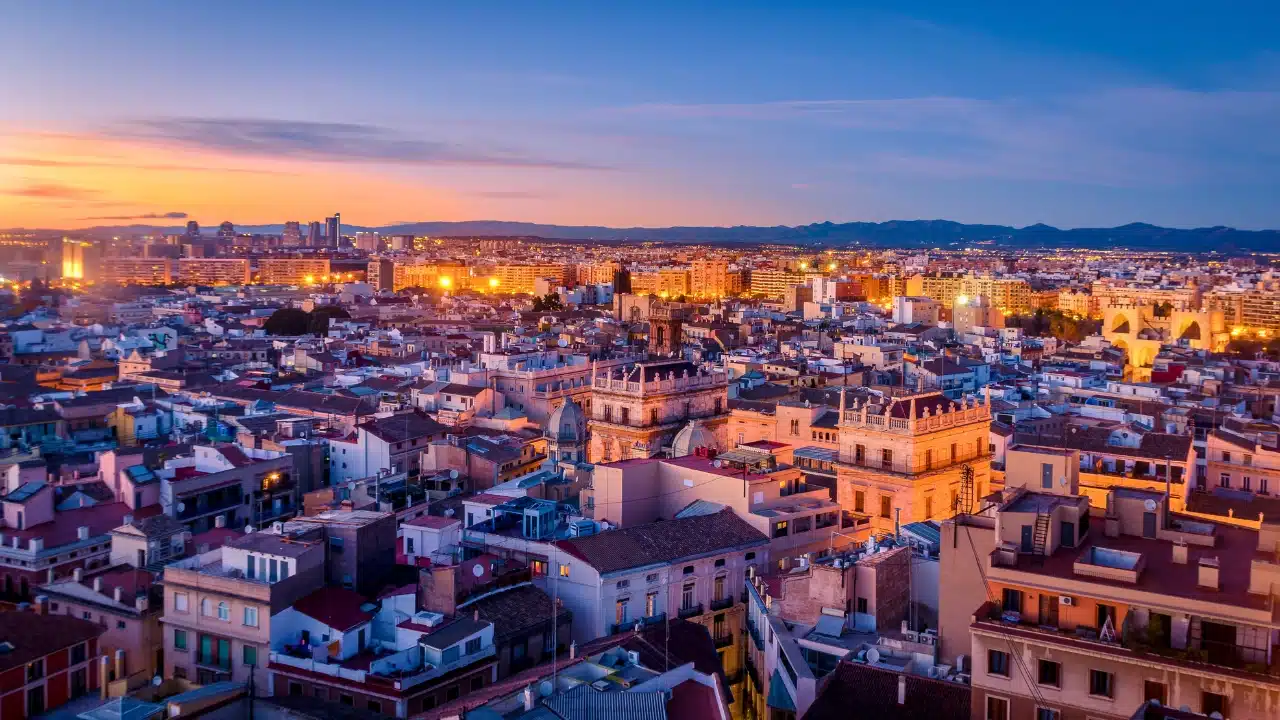 Panoramic sunset view of Valencia, Spain, highlighting the historic city center, beautiful architecture, vibrant skyline, and Mediterranean atmosphere, making it one of Spain's top cultural and travel destinations.