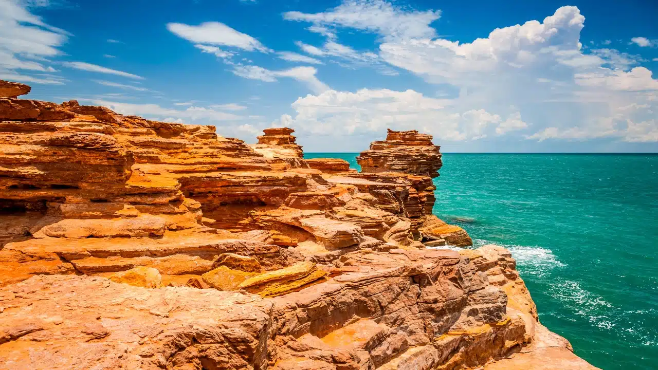 Gantheaume Point in Broome, Western Australia, with red rock cliffs overlooking the turquoise Indian Ocean